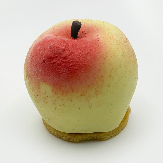 Refined individual dessert featuring apple whip ganache, caramelized cinnamon apple tatin, delicate seed crème, and a moist corn cake base.