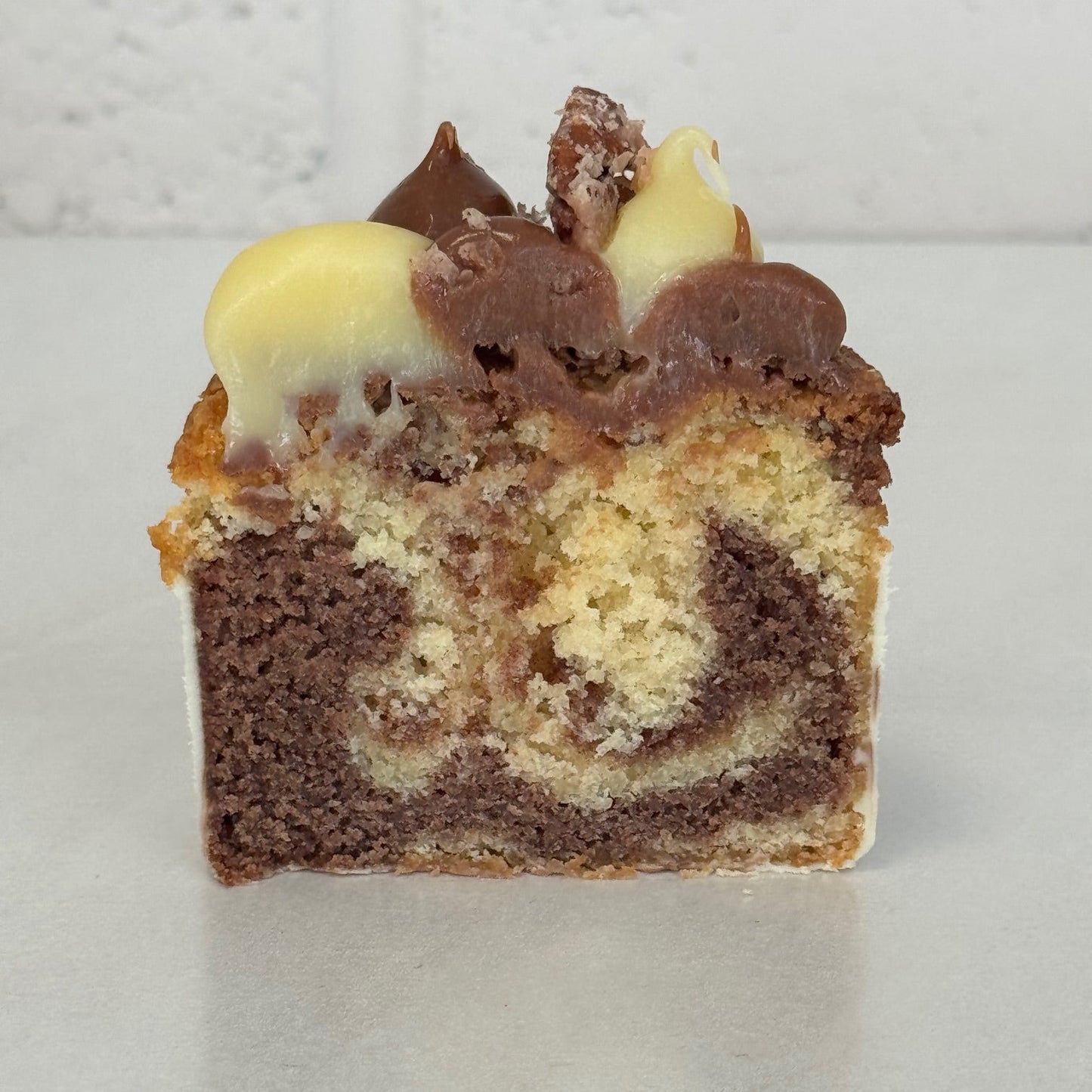 Half chocolate and vanilla marble cake with chocolate topping