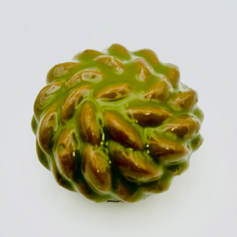 "Plant-based individual dessert with layers of tangy lemon curd, apple caramel, a soft apple brownie, and oatmilk chocolate mousse, topped with a glossy apple mirror glaze."