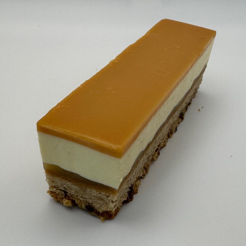 "sleeve dessert featuring spiced apple cake, apple compote, velvety mascarpone mousse, and a layer of salted caramel ganache."