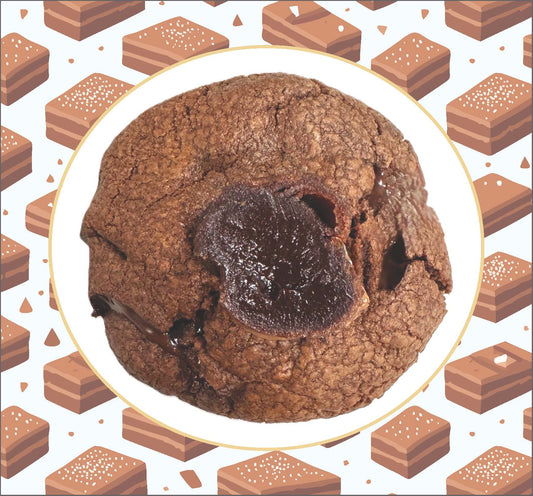 Close-up of a brownie cookie with a gooey liquid brownie center oozing through the middle.